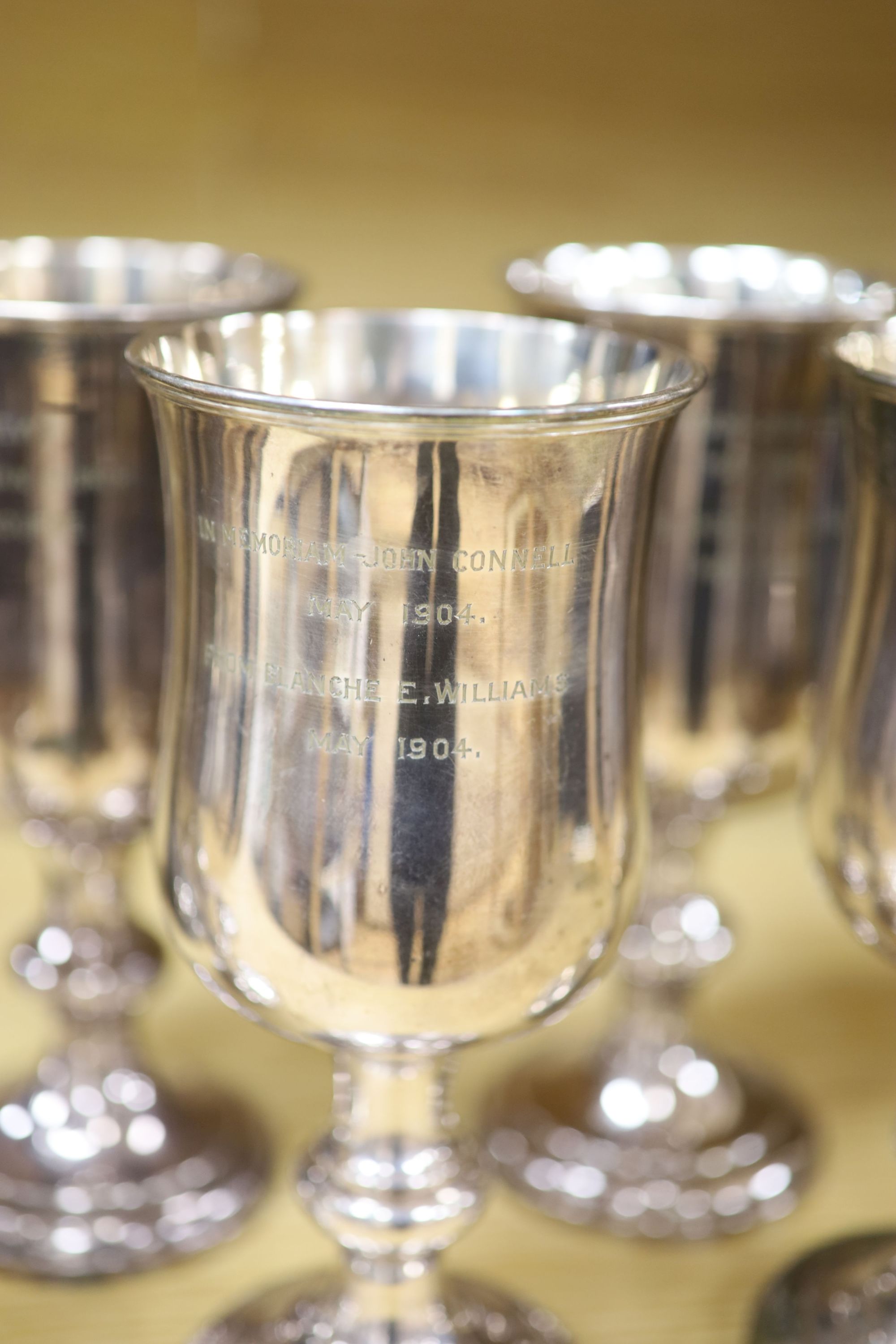 A Collis & Co Church silver plate lidded ewer, a set of six goblets from St Andrews Presbyterian Church, Eastbourne and a communion cup